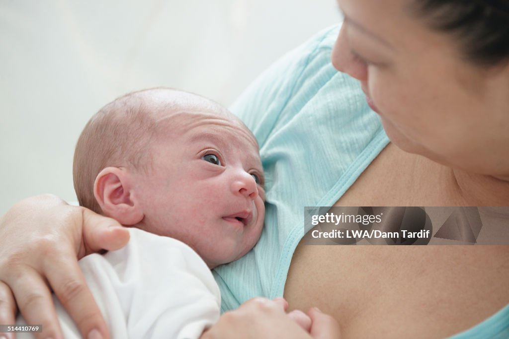 Chinese mother holding newborn