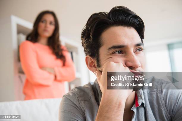 couple arguing in living room - ignoring stock pictures, royalty-free photos & images