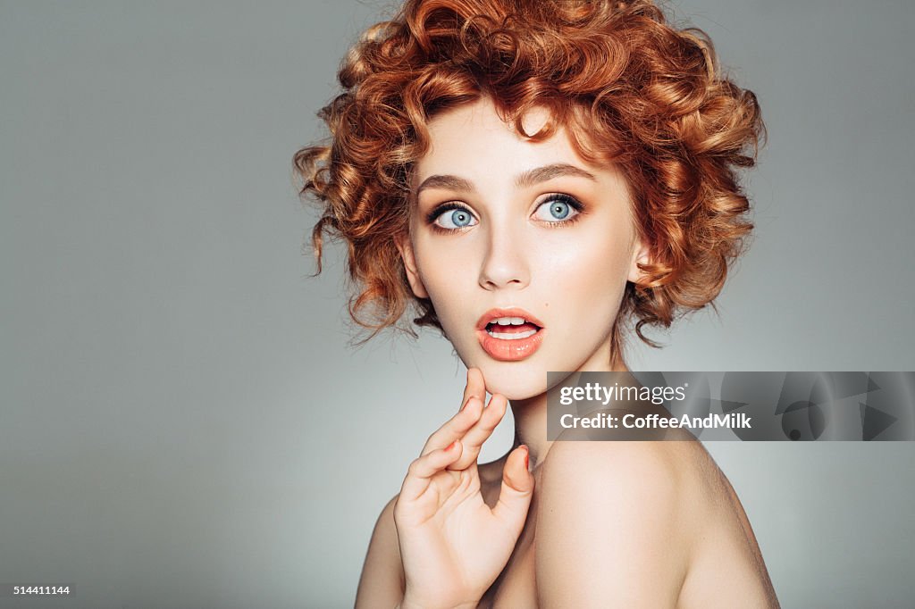 Beautiful woman with red curly hair