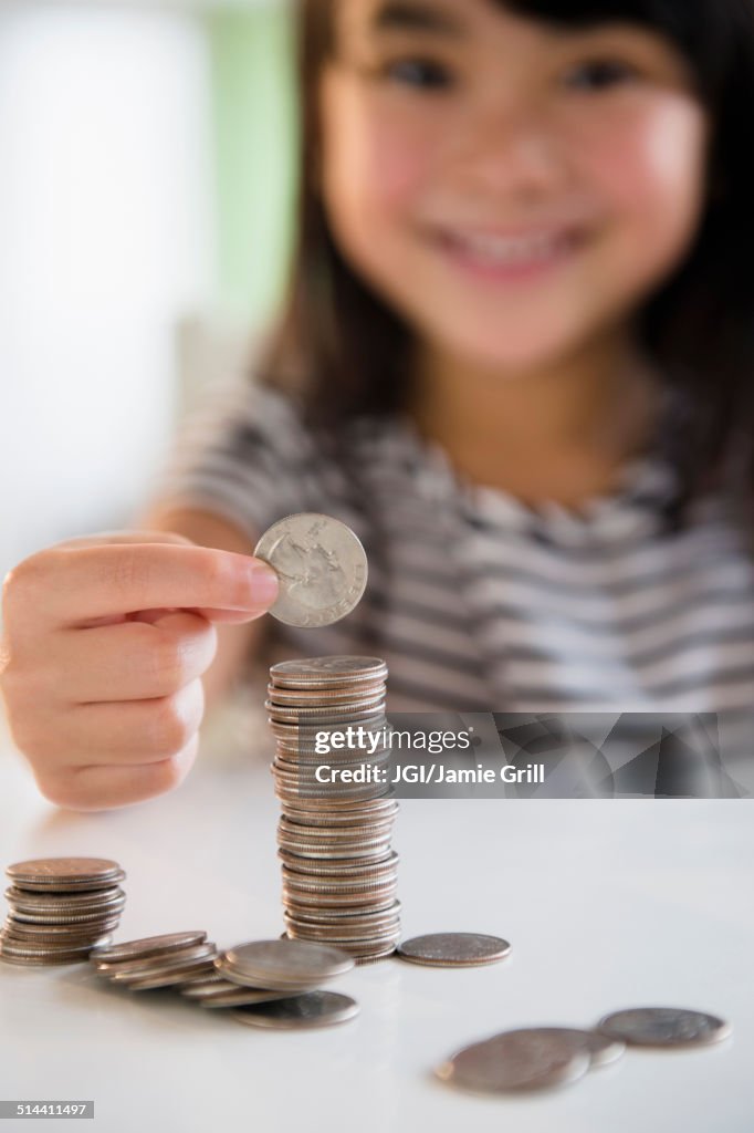 Filipino girl counting coins