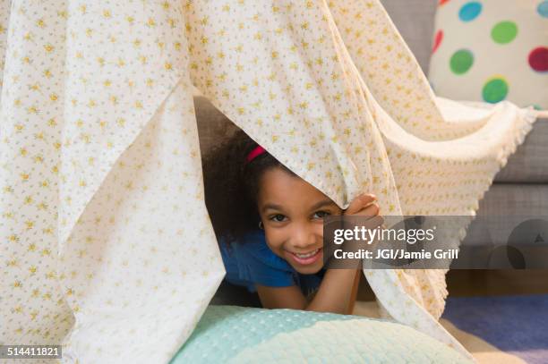 african american girl playing in blanket fort - fortress stock pictures, royalty-free photos & images