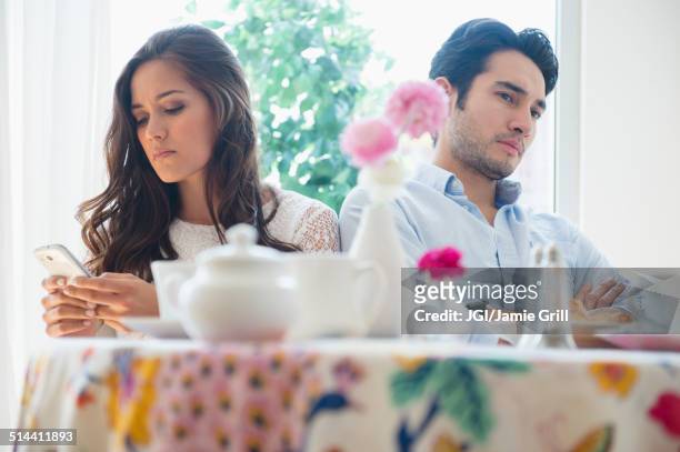 couple arguing in restaurant - relationship difficulties photos stock pictures, royalty-free photos & images
