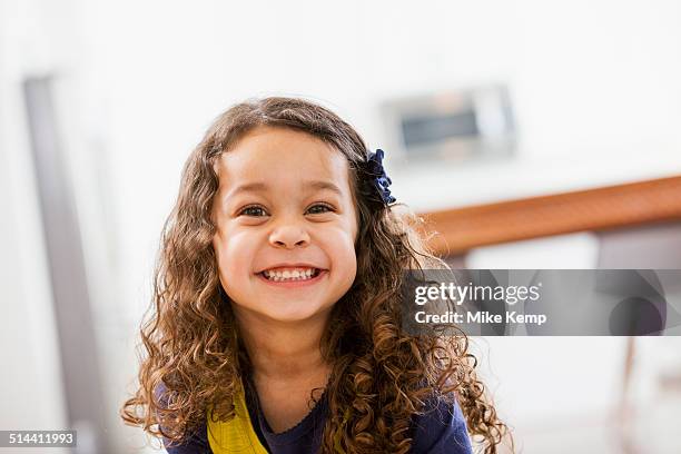 mixed race girl smiling - two girls brown hair stock pictures, royalty-free photos & images