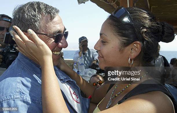 Israelis cross the border into the Israeli town of Eilat from the Egyptian resort of Taba on the Red Sea on October 8, 2004 in Eilat Israel....