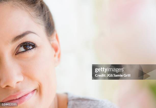 close up of woman looking up - candid beautiful young woman face stock pictures, royalty-free photos & images