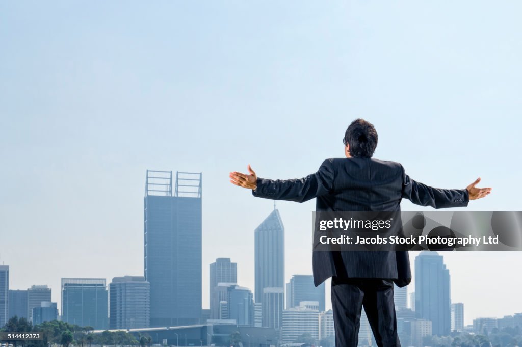 Hispanic businessman admiring Perth city skyline, Perth, Western Australia, Australia