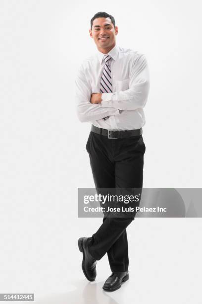 mixed race businessman smiling with arms crossed - skjorta och slips bildbanksfoton och bilder