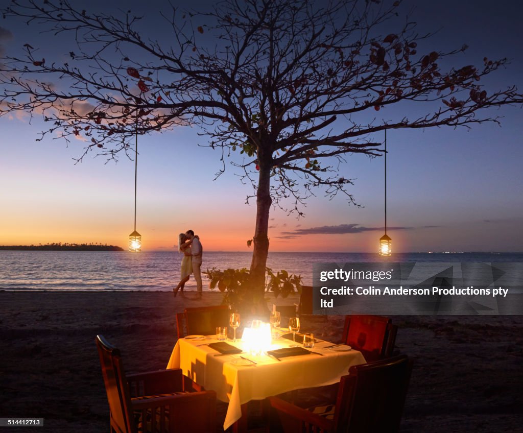 Caucasian couple relaxing at beach restaurant