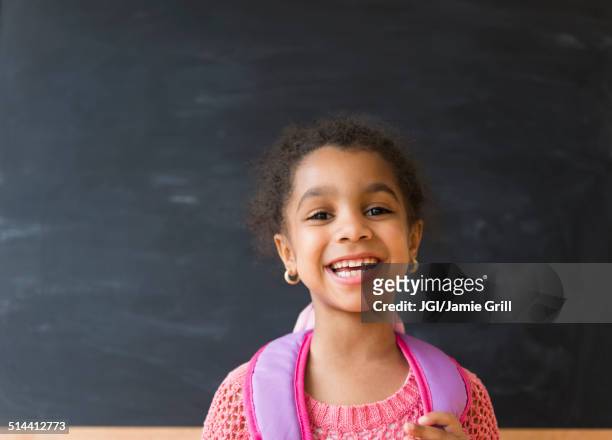 African American girl smiling in classroom