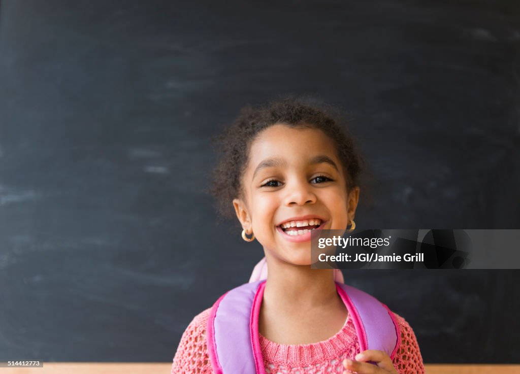 African American girl smiling in classroom