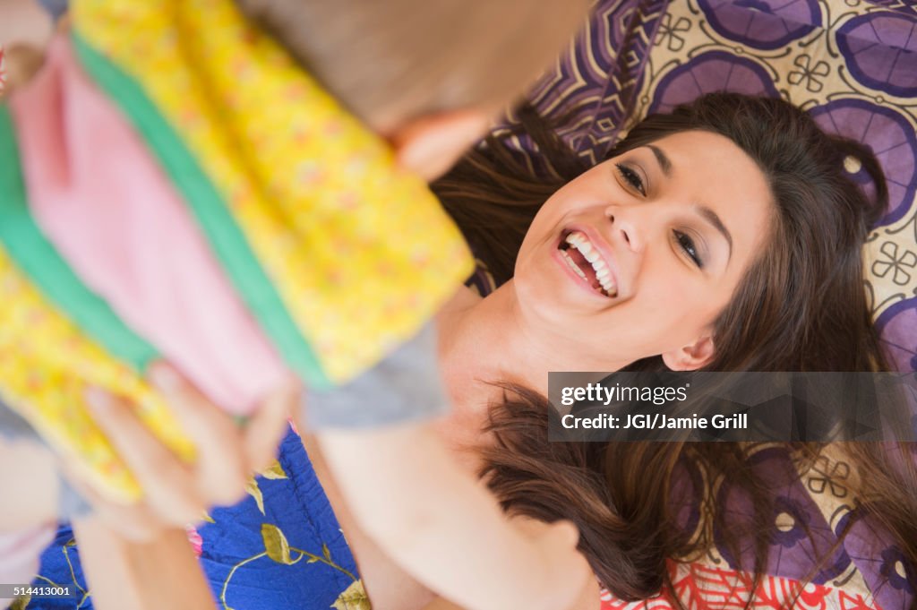 Mother and child playing on rug