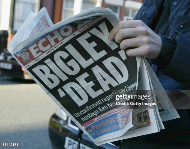 Man reads the local paper following the announcement that, British hostage Ken Bigley, had been beheaded by an extremist terror group in Iraq on...