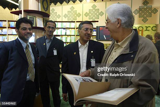 Arabic people discuss a book at the Frankfurt bookfair on October 8, 2004 in Frankfurt, Germany. The Frankfurt Bookfair is the world's largest event...