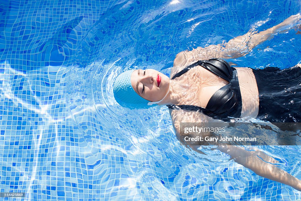 Retro woman in swimming pool