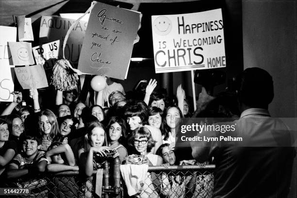 Waving signs, fellow classmates and fans wait at the airport for American tennis player Chris Evert to deplane as she retuens from an impressive...