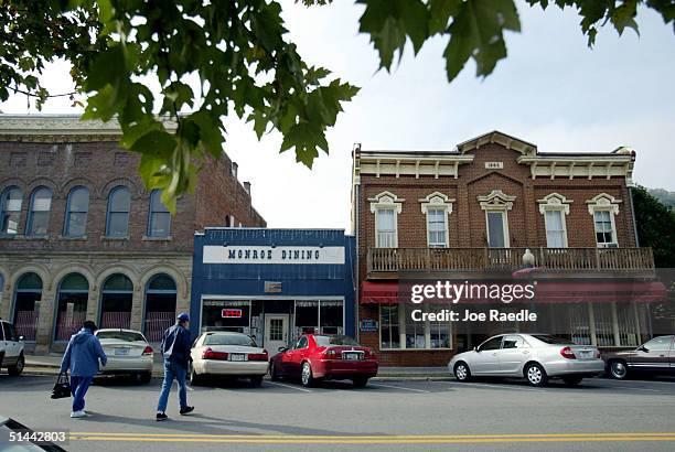 Pedestrians walk in downtown Alderson near Alderson Federal Prison Camp where Martha Stewart turned herself in October 8, 2004 in Alderson, West...