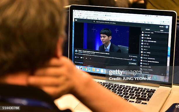 Member of the AlphaGo team watches an online live streaming of the Google DeepMind Challenge Match at a hotel in Seoul on March 9, 2016. A...