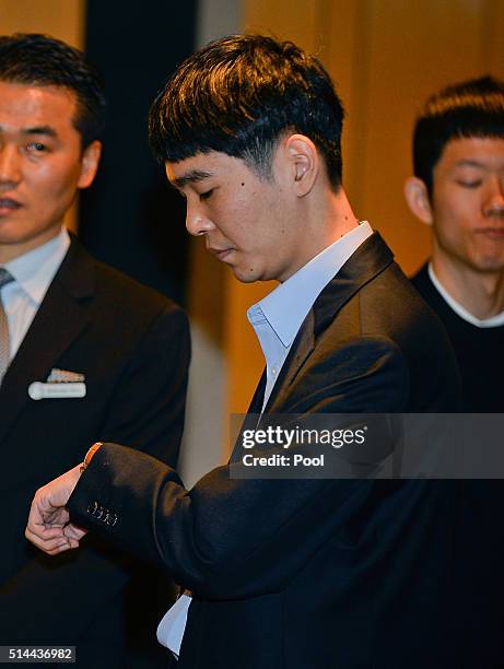 South Korean professional Go player Lee Se-Dol watches his clock before the match against Google's artificial intelligence program, AlphaGo, on March...