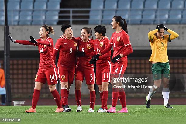 Ma Xiaoxu of China celebrates scoring her team's first goal with her team mates during the AFC Women's Olympic Final Qualification Round match...