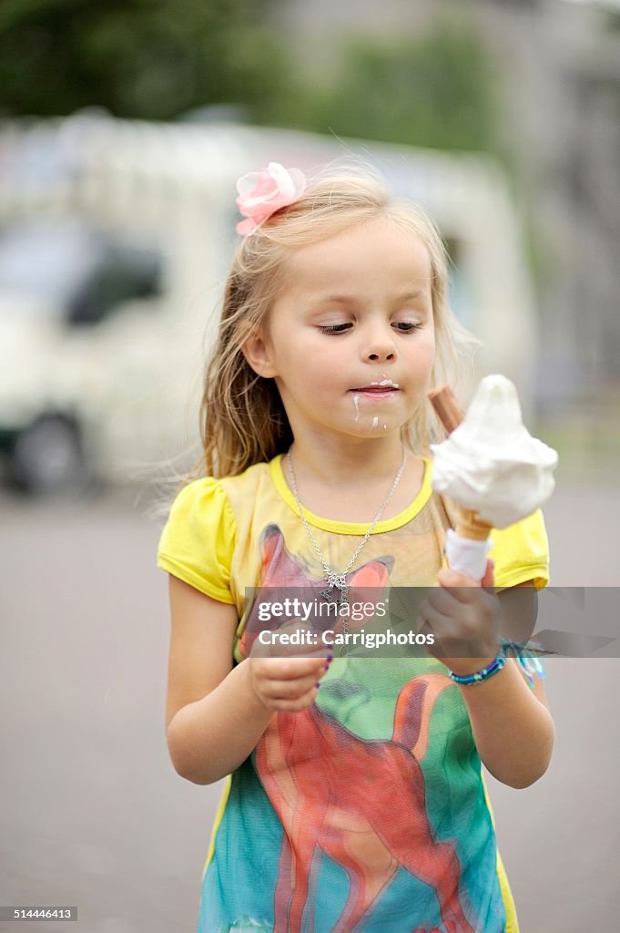 Girl (2-3) eating ice-cream