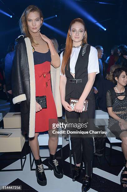 Karlie Kloss and Sophie Turner attend the Louis Vuitton show as part of the Paris Fashion Week Womenswear Fall/Winter 2016/2017 on March 9, 2016 in...