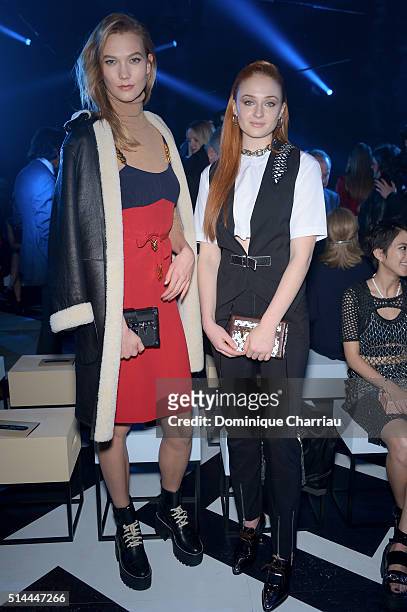 Karlie Kloss and Sophie Turner attend the Louis Vuitton show as part of the Paris Fashion Week Womenswear Fall/Winter 2016/2017 on March 9, 2016 in...