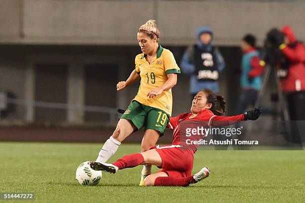 Katrina Gorry of Australia is tackled by Wu Haiyan of China during the AFC Women's Olympic Final Qualification Round match between Australia and...