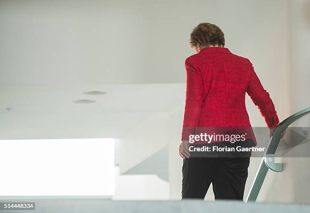 German Chancellor Angela Merkel goes downstairs at the chancellery on March 09, 2016 in Berlin, Germany.