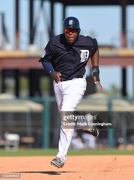 John Mayberry Jr. #64 of the Detroit Tigers runs the bases during the Spring Training game against the Miami Marlins at Joker Marchant Stadium on...