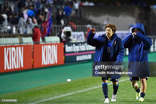 Aya Miyama of Japan applauds supporters while Mana Iwabuchi sheds tears after the AFC Women's Olympic Final Qualification Round match between Japan...