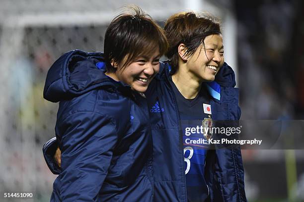 Aya Miyama and Mana Iwabuchi of Japan applaud the supporters after the AFC Women's Olympic Final Qualification Round match between Japan and North...