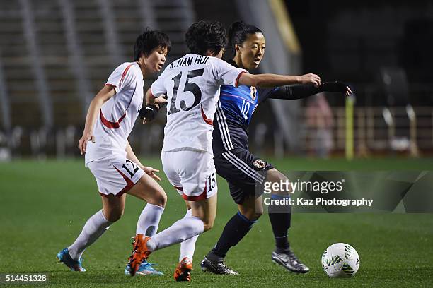 Yuki Ogimi of Japan competes for the ball against Kim Yun Mi and Kim Nam Hui of North Korea during the AFC Women's Olympic Final Qualification Round...