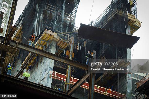 New York, United States of America Workers balancing on a construction site of a skyscraper in New York on steel beams on February 25, 2016 in...
