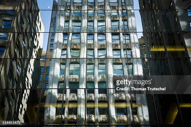 New York, United States of America Houses are reflected in the glass facade of a skyscraper in Manhattan. On February 27, 2016 in New York, United...