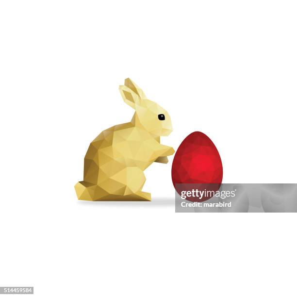 low poly gold rabbit and red easter egg over white - easter egg isolated stock illustrations