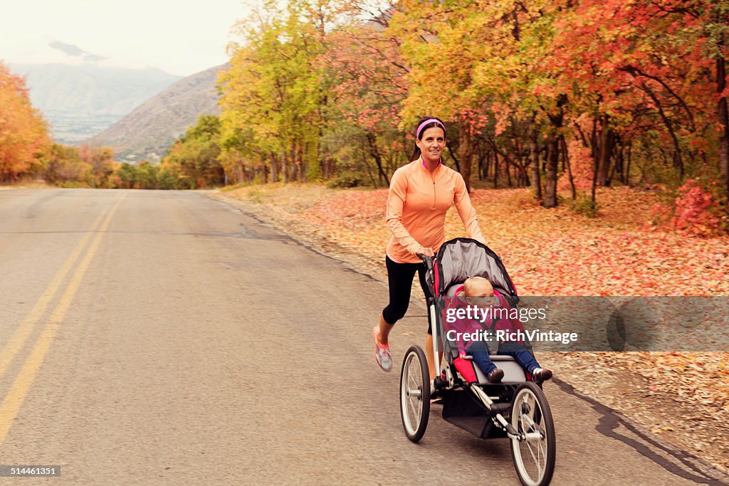 Mother Running with Daugter in Jogging Stroller