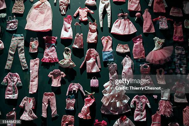 Barbie dolls clothes are displayed during the exhibition "Barbie, life of an icon" at the Museum of Decorative Arts as part of the Paris Fashion Week...