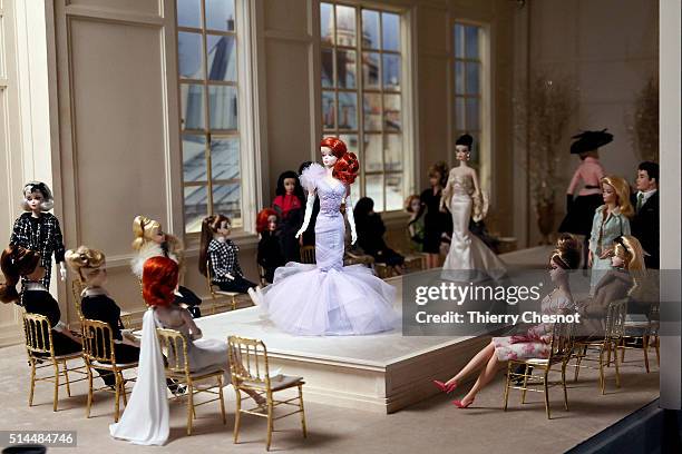 Barbie dolls are displayed during the exhibition "Barbie, life of an icon" at the Museum of Decorative Arts as part of the Paris Fashion Week...