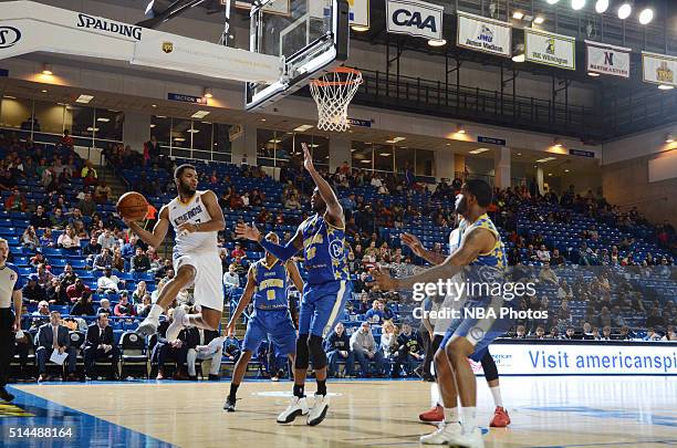 Andrew Harrison of the Iowa Energy drives to the basket and makes a pass against the Delaware 87ers on March 4, 2016 at the Bob Carpenter Center in...