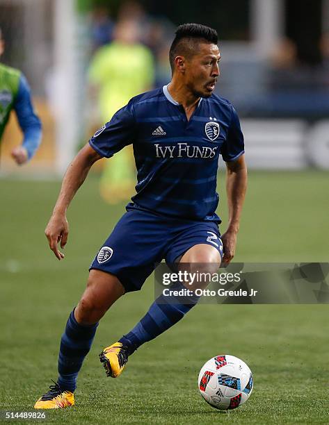 Roger Espinoza of Sporting Kansas City dribbles against the Seattle Sounders FC at CenturyLink Field on March 6, 2016 in Seattle, Washington.