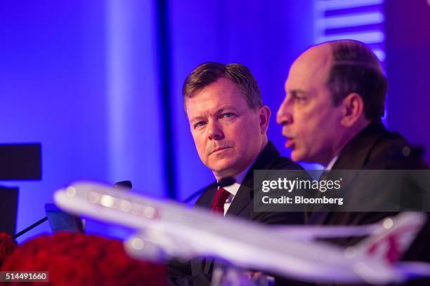 Jonathan Harding, vice president of Europe at Qatar Airways Ltd., left, looks on as Akbar Al Baker, chief executive officer of Qatar Airways Ltd.,...