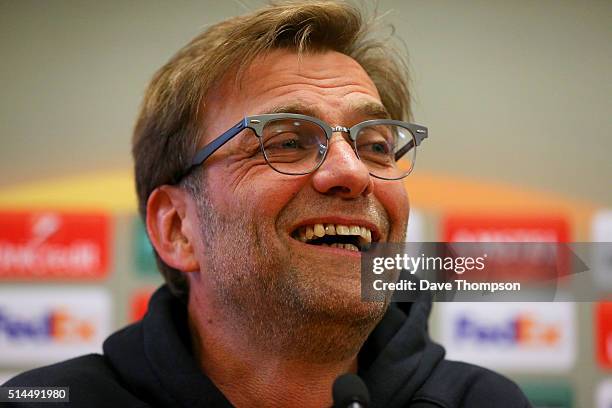 Jurgen Klopp, Manager of Liverpool smiles during a press conference ahead of the UEFA Europa League round of 16 first leg match between Liverpool and...