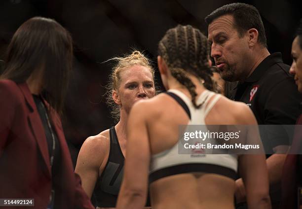 Holly Holm and Miesha Tate face off before their women's bantamweight championship bout during the UFC 196 in the MGM Grand Garden Arena on March 5,...