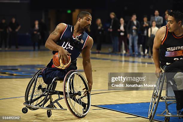Paralympic medalist Trevon Jenifer demonstrates wheelchair basketball during the 2016 Team USA Media Summit at UCLA's Pauley Pavilion on March 8,...