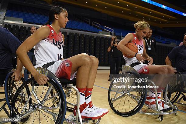 Candice Parker and Elena Della Donne participate in a wheelchair basketball demonstration during the 2016 Team USA Media Summit at UCLA's Pauley...