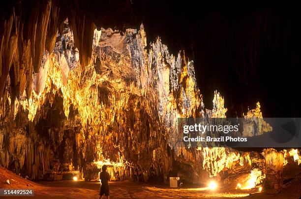 Meters of galleries with stalagmites are illuminated by electric light inside Gruta da Mangabeira , near Ituaçu city in Bahia State, Brazil.
