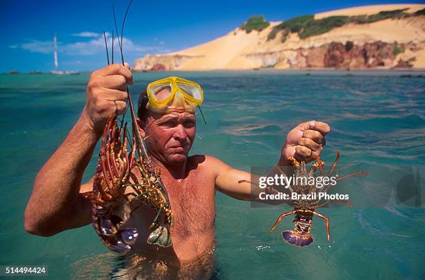 Sport lobster fishing with mask and snorkel, Ceara State coastline, tropical beach, Brazil.