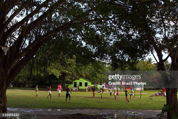 Young men play soccer at Trancoso, daily life in village, Bahia State, Brasil.