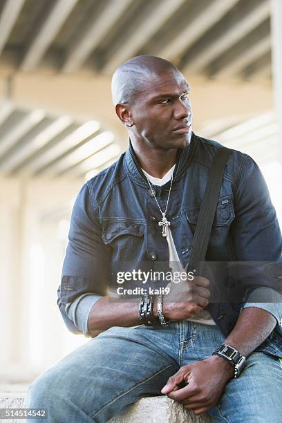 black man wearing jewelry and denim - all hip hop models stock pictures, royalty-free photos & images