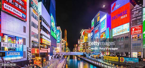 colourful neon billboards illuminating iconic dotonbori canal panorama osaka japan - osaka prefecture stock pictures, royalty-free photos & images